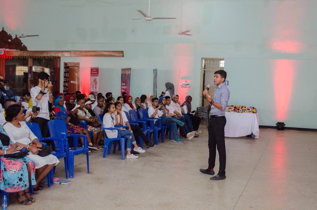 Ziyaan Virji speaking to a room of young people